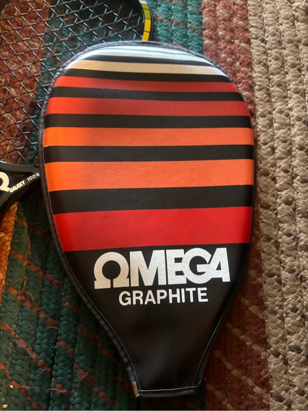 Omega Black Racketball Racket with Red and Yellow Accents - Picture 2 of 6